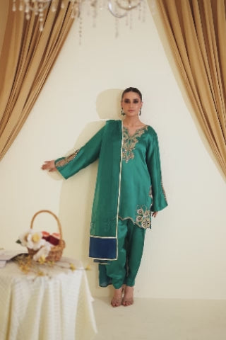 Video of model showcasing Ameura teal tassar silk Eid set with French knots, tilla, crystal detail, and sequined dupatta, moving to highlight kurta, pants, and festive embroidery by Shireen Lakdawala.
