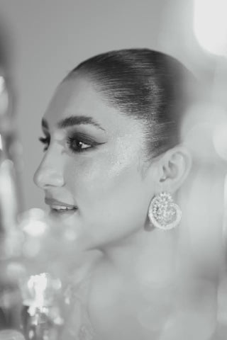 Video of model showcasing Reeya with floral threadwork, sequins, and crystal detail, moving to highlight kurta, pants, and silk dupatta by Shireen Lakdawala.
